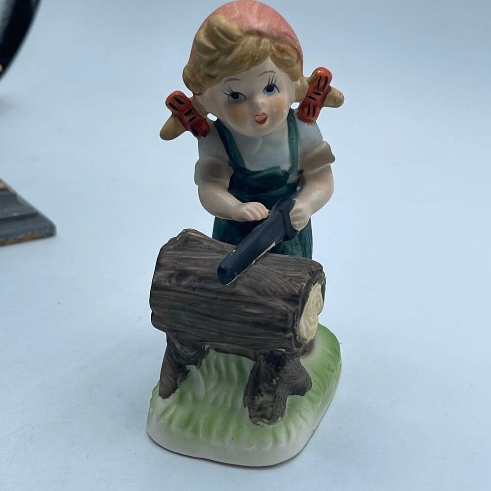 Vintage “Collector’s  Choice Series “‘girl sawing log.